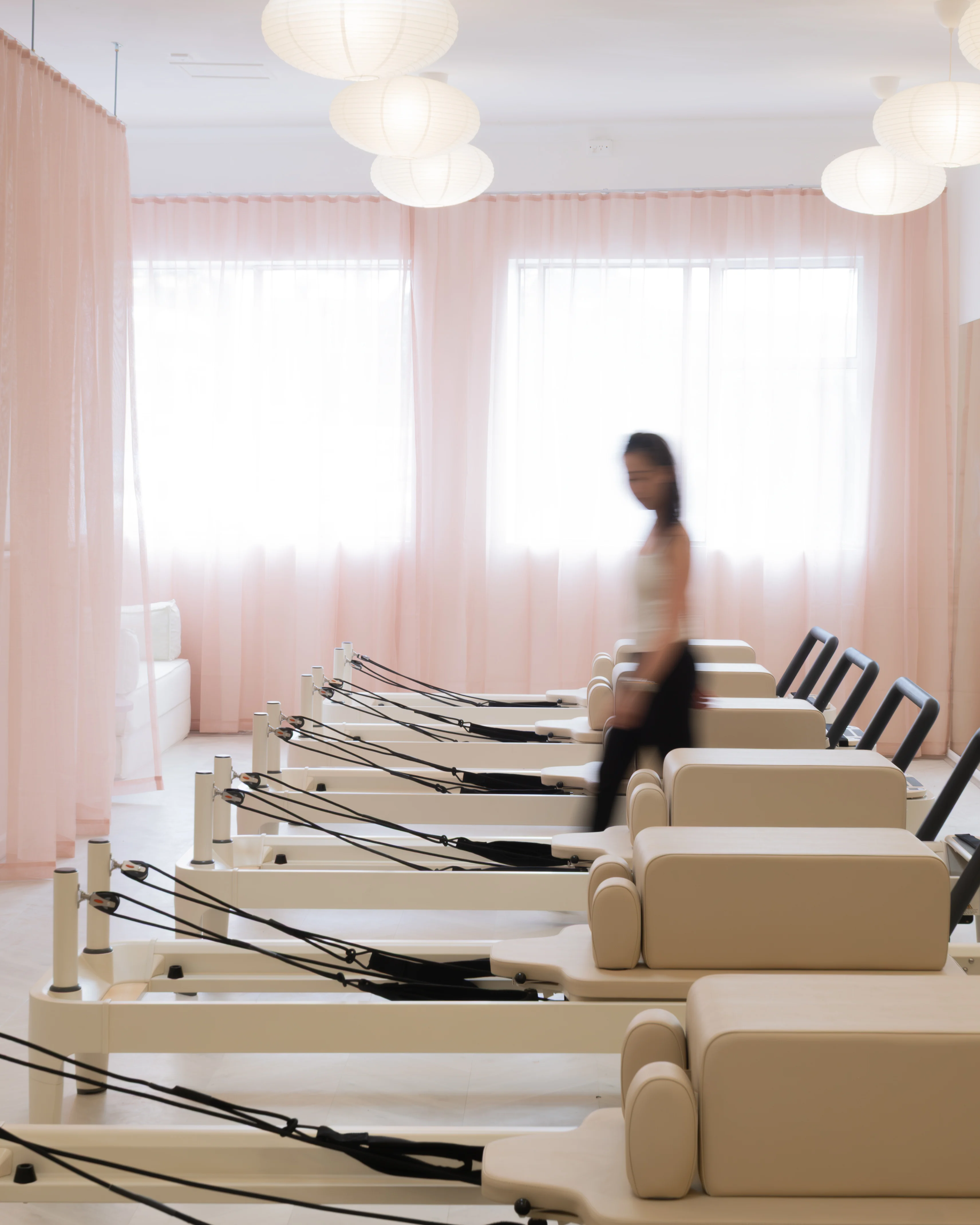 Reformer beds lined up in the studio